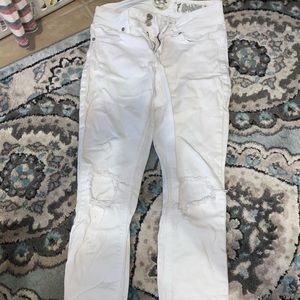 White jeans with holes in the knees
